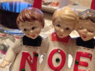 This is a picture of a bitchy-looking christmas tchotchke that says "Noel" but I like how it looks like it says "Noe" kinda like bae. Also, THAT FACE THO.